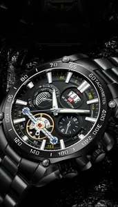 Close-up of VA VA VOOM men's black tourbillon watch with tachymeter and steel band