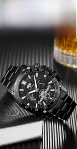 VA VA VOOM Men's black steel watch featuring a tourbillon-style dial on a black notebook