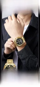 Detailed close-up of VAVA VOOM gold chronograph watch with black dial and metal strap