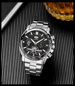 Detailed macro view of the silver stainless steel watch with black chronograph dial and tachymeter