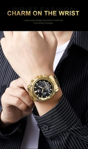 Close-up of luxury gold stainless steel watch with black multi-functional chronograph dial