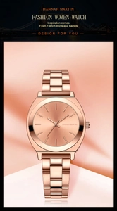 Close-up of rose gold minimalist ladies watch on soft pink silk textured background