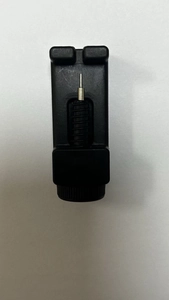 Precision watch band link remover tool with black plastic base and silver metal pin
