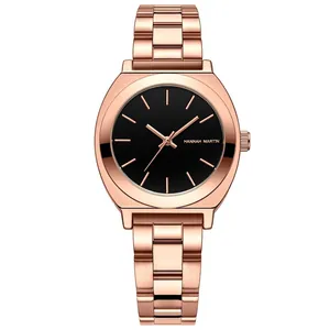 Hannah Martin rose gold stainless steel watch with a minimalist black dial and mesh strap