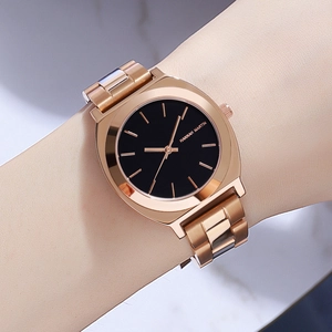 Hannah Martin rose gold quartz watch with black dial and minimalist steel link bracelet