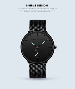 Close-up of a black quartz watch with a blue second hand and mesh stainless steel strap