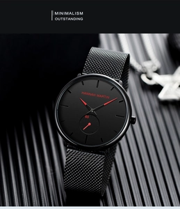 Detail of Hannah Martin black minimalist quartz watch with red hands and mesh strap
