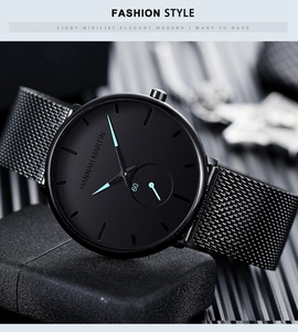 Detail of Hannah Martin black minimalist quartz watch with stainless steel mesh strap