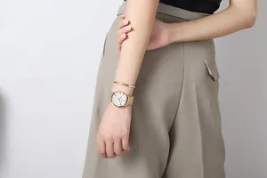 Close-up of rose gold quartz watch and matching bracelet on woman's wrist