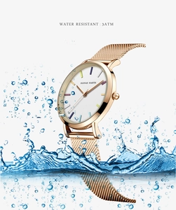 Water splash scene showing the 3ATM water resistant feature of a rose gold mesh watch