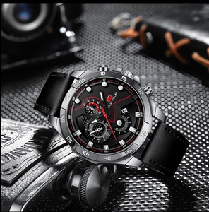 Detail of men's chronograph watch with silver stainless steel case and black leather strap