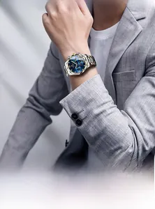 Close-up of a blue and gold men's business watch with multi-functional dial details