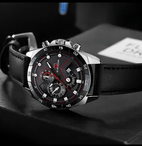 Detailed macro view of black leather watch strap and silver stainless steel case finish
