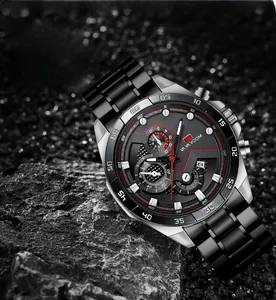 Macro shot of black stainless steel business watch with chronograph dial on dark stone background