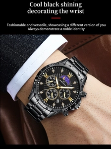 Detail of a black metal men's watch with Roman numerals, moon phase and sub-dials
