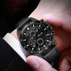 Close-up of VA VOOM black chronograph watch with leather strap on a man's wrist
