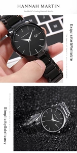 Detail of Hannah Martin black stainless steel quartz watch with date window and sleek band