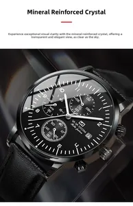 Macro shot of mineral glass watch face with date display and chronographs
