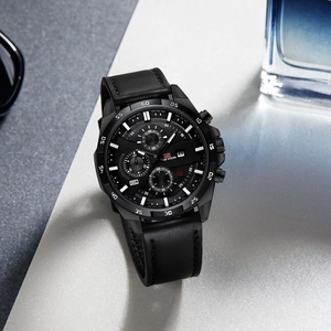 Detail view of men's black quartz watch with leather strap and chronograph sub-dials