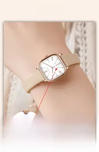 Detailed macro view of the rectangular rose gold watch face with sub-dial and leather strap
