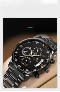 Macro view of the black and gold stainless steel watch face with three sub-dials and calendar