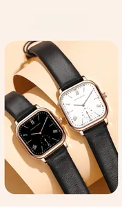 Detail view of square rose gold watches with black leather straps and Roman numerals