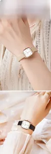 Elegant square dial ladies watch with rose gold case and slim leather strap detail