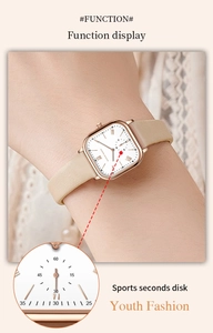 Detailed close-up of rose gold square watch face with leather strap and sub-dial