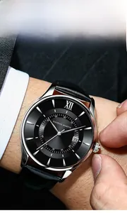 Macro shot of Hannah Martin watch featuring a black dial and a date window on a wrist