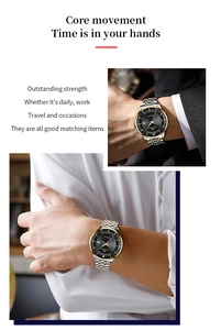 Detail of business watch with black dial and silver-gold stainless steel band on wrist