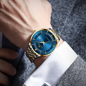 Men's business quartz watch with blue sunray dial and two-tone steel strap on wrist