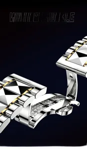 Macro view of stainless steel watch butterfly clasp with two-tone silver and gold finish