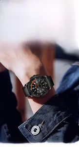 Close-up of WWOOR men's quartz watch with black leather strap and orange hour markers