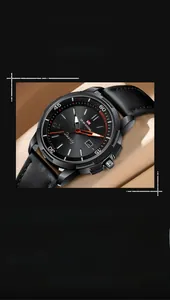 Macro shot of business quartz watch with black sunray dial and red second hand
