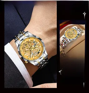Macro shot of gold skeleton dial and two-tone stainless steel strap on men's business watch