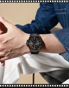 Men's business quartz watch with black leather strap worn by model in casual setting