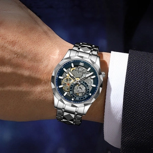 Men's hollow dial quartz watch with silver steel strap and faceted blue bezel