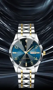 Detail of blue sunray dial with double calendar and diamond-cut glass on steel watch