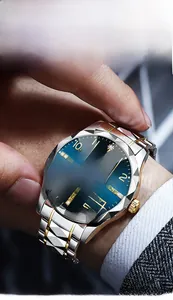 Close-up of luxury men's watch featuring a diamond-cut glass and blue sunray dial