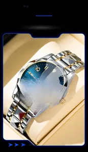 Detail view of men's watch with blue sunray dial and faceted diamond-cut steel bezel
