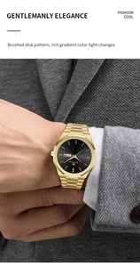 Close-up of golden stainless steel watch with black sunray dial and day-date display