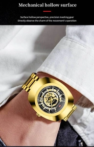 Detailed macro view of the gold hollow movement and gears on a luxury men's watch