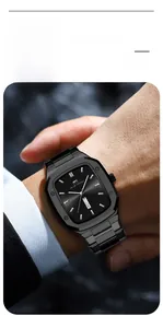 Macro view of rectangular business watch with dual calendar display and black steel strap