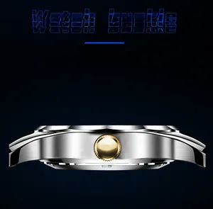 Close-up of brushed metal watch case with gold-tone crown and industrial design