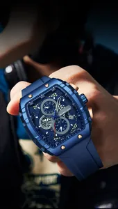 Men's blue tonneau quartz watch with rose gold bezel screws on a model wrist
