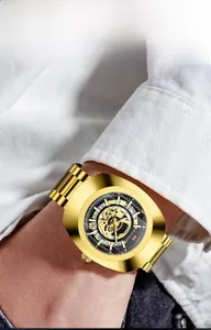 Detailed close-up of VAVA VOOM skeleton watch dial showing golden mechanical gears
