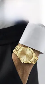 Detail of VAVA VOOM gold men's quartz watch with double calendar and steel strap on wrist