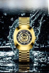 Close-up of golden automatic skeleton watch with 30M waterproof rating and water splash effect