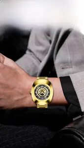 Detail of a luxury gold hollow-out skeleton watch dial with luminous metal wristband