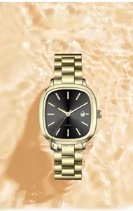 Detail of square gold watch with black dial and date window over ripples